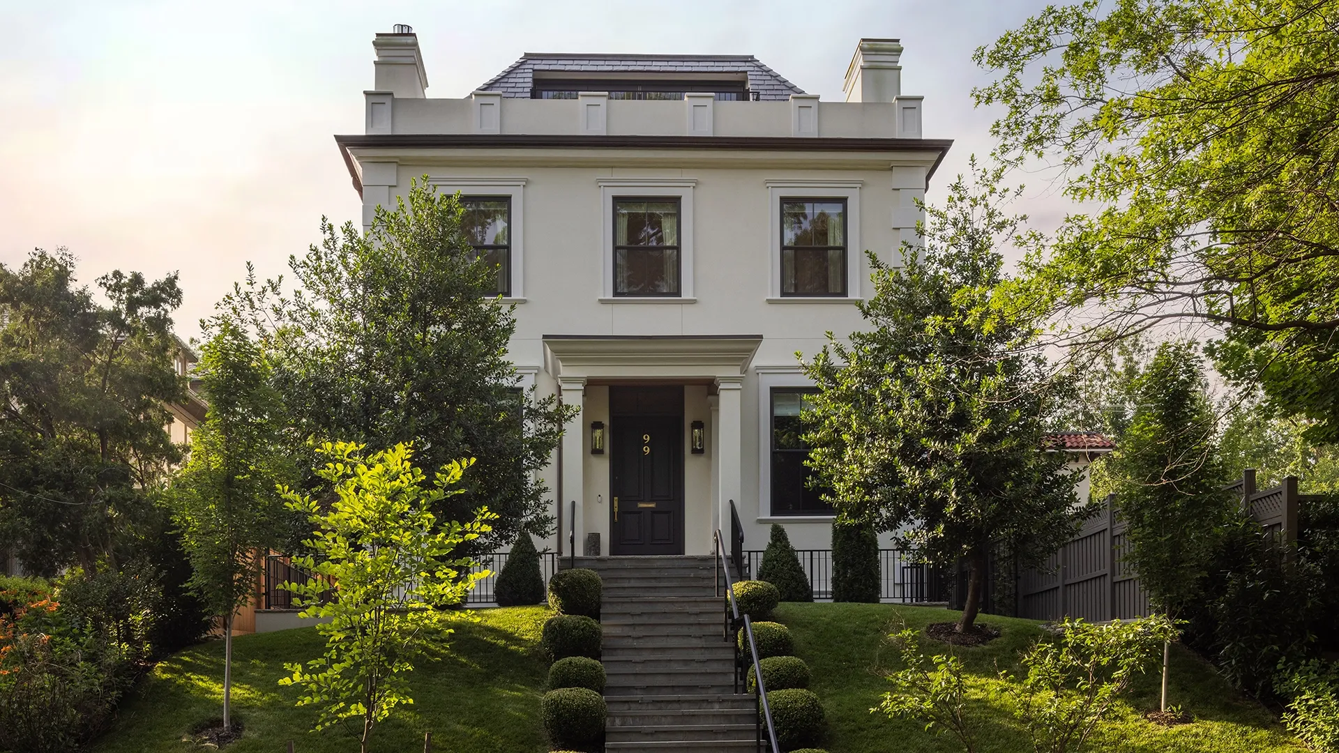 Front entrance of a contemporary home, with crafted facade, clean lines, and welcoming front path. Custom Home in Washington, DC.